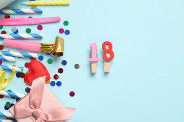 Festive birthday accessories with date 18 year on blue background.