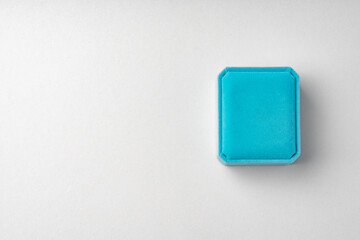 Small jewelry box on gray background close up
