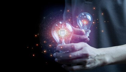 Man holding light bulb, new idea with AI technology, innovation and creativity. Get creative with glowing light bulbs.