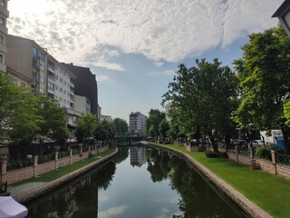 view of a small river and trees from a bridge in a park in the city of Eskişehir