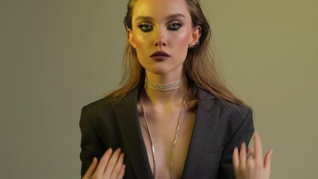 Fashion shoot in a model studio with colorful lights and creative make-up