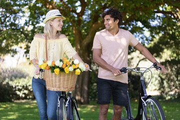 couple riding on bicycles and having fun