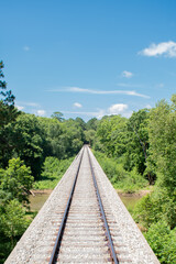Rail road train tracks over a bridge