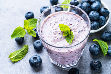 Blueberry smoothie or milkshake with fresh berries.