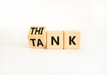 Think tank symbol. Businessman turns wooden cubes and changes the word Tank to Think or vice versa....