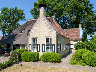 Fototapeta na wymiar Historic lockkeeper's house in Appelscha,, Friesland province, The Netherlands || Historisch sluiswachterhuis in Appelscha,