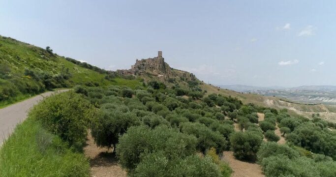 Aerial drone view in Craco, Italy. Small town built on a clay hill. Ghost town causes landslides and earthquake. An isolated ghost town set famous for horror films and dramatic sceneries.