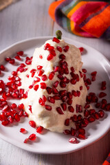 Chiles en Nogada, Typical dish from Mexico. Prepared with poblano chili stuffed with meat and fruits and covered with a walnut sauce. Named as the quintessential Mexican dish for national holidays.