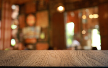 Empty wood table top and blur of out door garden background Empty wooden table space for text marketing promotion. blank wood table copy space for background