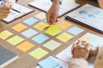 Business People brainstorming Meeting Design Ideas use post it notes to share idea professional...
