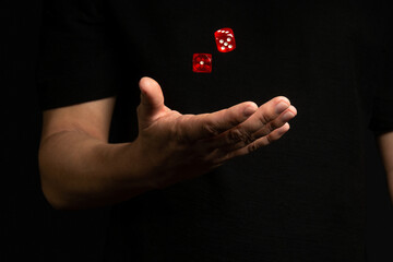Dice in male hands. Red Dice. Gambling. Casino. Shoot dice.