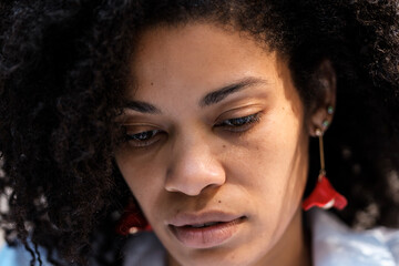 Close head-shot of depressed black female.