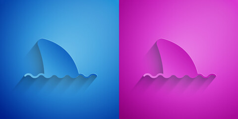 Paper cut Shark fin in ocean wave icon isolated on blue and purple background. Paper art style. Vector