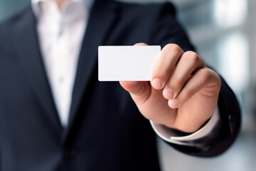 Fototapeta premium A person holding a business card in their hand