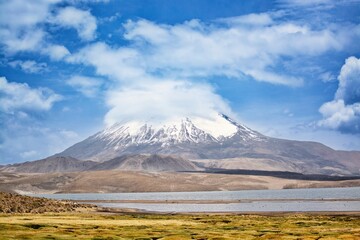 Fototapeta premium View of the Parinacota lake and Parinacota mountain, Chile. Chungara Lake Volcan en el Lago Chungará
