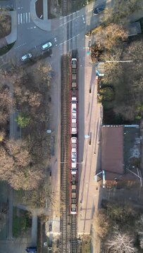 Aerial Horizontal View of WKD Railway and Following a Train in Podkowa Lesna, Warsaw, Poland