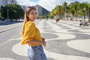 Copacabana stylish woman walking on famous promenade in Rio de Janeiro, Brazil © zigres