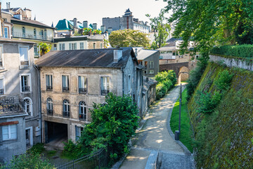Narrow streets next to old buildings of the medieval city of Pau next to the Pyrenees, France.