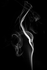 Coloured smoke. Black background. Colourful smoke images. Abstract photographs of smoke.