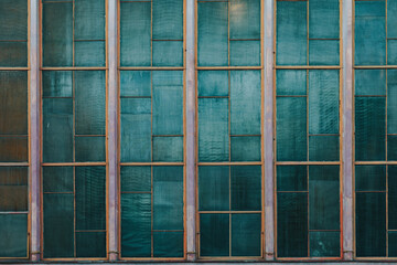 old, green, reinforced glass in the windows 