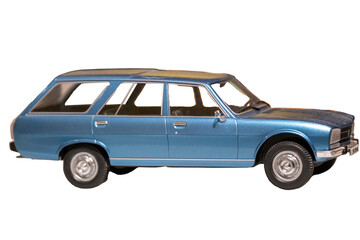 Image of an old, vintage blue station wagon scale model car isolated on white with a clipping path. Selective focus