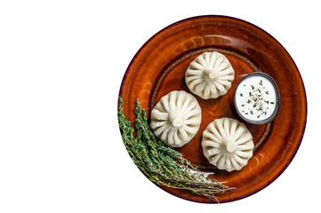 Fototapeta na wymiar Khinkali Dumplings with beef and lamb meat on rustic plate with herbs. High quality Isolate, transparent background