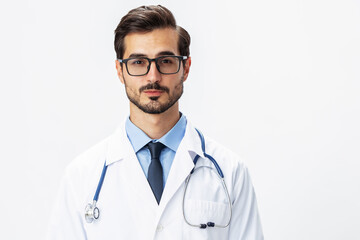 Fototapeta premium Man portrait of a doctor wearing a white coat and eyeglasses and a stethoscope looking into the camera on a white isolated background, copy space, space for text, health