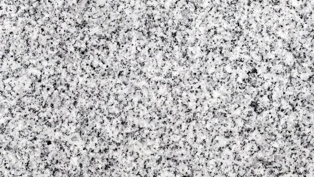 Background marble crumb black and white surface, rotating, turning, close-up, looped video
