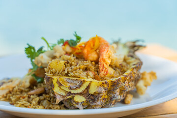 Seafood fried rice in pineapple, appetizing in a cafe next to the sea, Sue Flamingo, Ao Yon Beach, Phuket Thailand