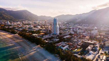 Obraz premium Phuket, Thailand, Patong Bay, Panoramic Nature Views from a Drone Camera Aerial view of Patong town in Phuket, Thailand. The sea is beautiful in the summer, the sun is shining, the morning 