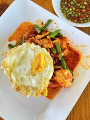 Rice topped with stir-fried pork and basil, Rice topped with stir fried minced pork and basil with Fried egg