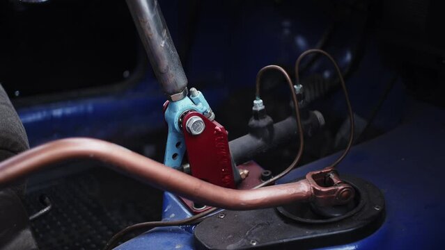 Close-up details of mechanisms of car. Clip. Levers inside old car. Details and internal mechanisms of old car