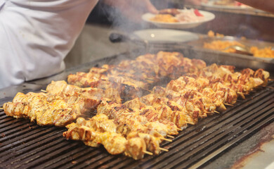 
meat and chicken dishes on the grill