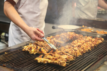 
meat and chicken dishes on the grill