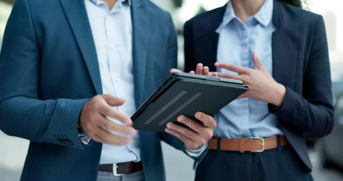 Hands, tablet and business people talking about planning, market research or information on company financial investment. Fintech, mobile app and professional employees in conversation about trading
