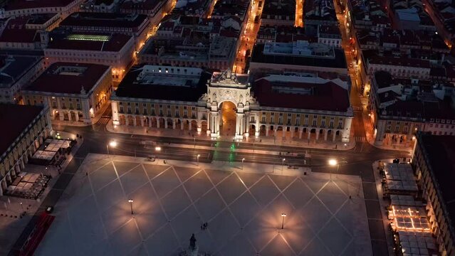 Aerial view of the main square Commerce square, statue of King Jose I and triumphal arch at night in Lisbon city, Portugal. one of the largest squares in Europe and is considered the Gateway to Lisbon