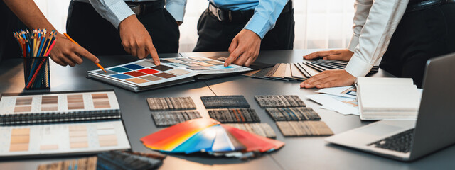 Group of professional interior designer and architect working together, planning and choosing color...