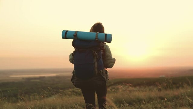 girl traveler runs sunset. millennial hipster girl. young woman with backpack runs sunset. hiking. holiday vacation arms sun. relaxation outdoors. state freedom image happy life. run woman vacation.