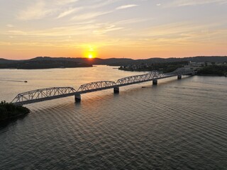 Obraz premium Bridge on Lake at sunset 