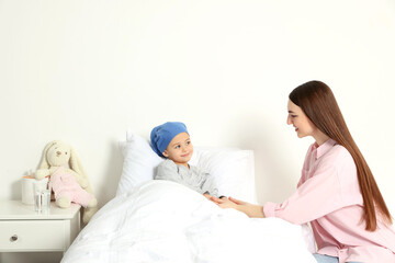 Childhood cancer. Mother and daughter in hospital