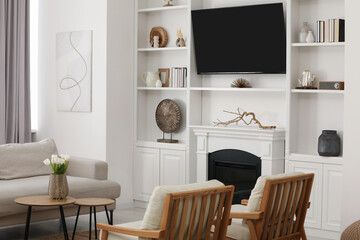 Fototapeta na wymiar Cozy room interior with stylish furniture, decorative fireplace and TV set