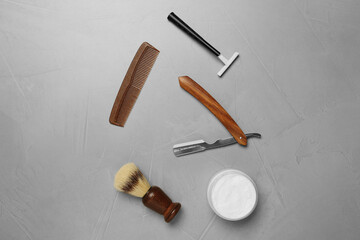 Fototapeta na wymiar Set of men's shaving tools on light gray table, flat lay