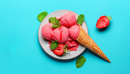 delicious strawberry ice cream on a plate with a cone