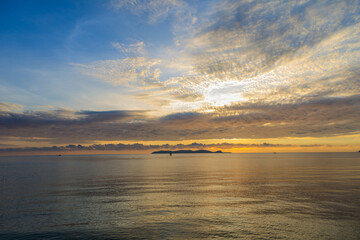 Fototapeta na wymiar Sunrise sky over horizon in morning with colorful clouds. Orange sunlight. sky background,