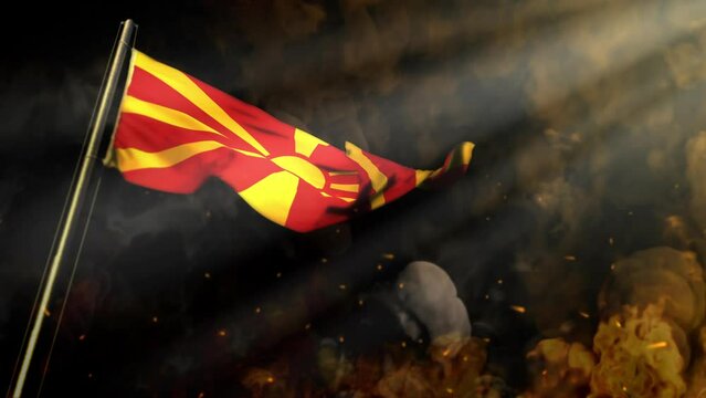 waving Macedonia flag on smoke and fire with sun beams - cataclysm concept