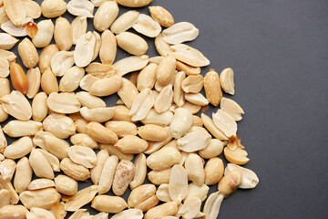 Whole shelled peanut nuts kernels close-up studio background