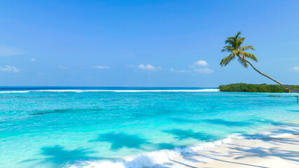 Fototapeta na wymiar The summer tropical on the sandy beach and turquoise Tropical beach with blue sky background