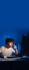 Portrait of young serious arabic gamer focused on online game, streaming live video,