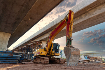 Excavator heavy machine at Structure road construction of expressway under construction. New road...