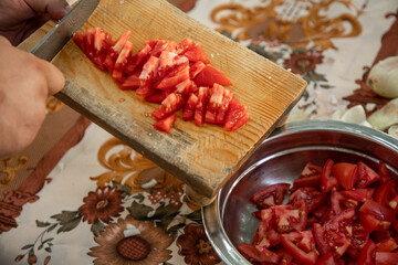 moving the cut onions to the container